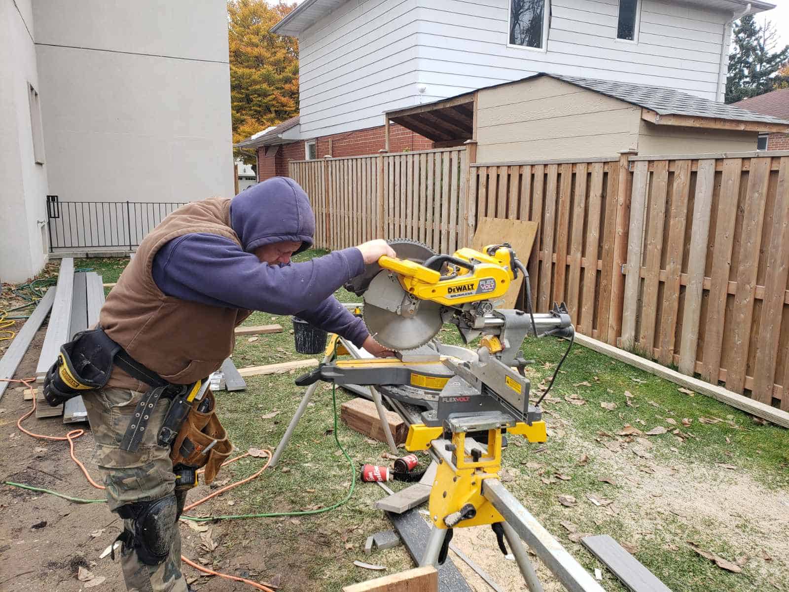 Ottawa deck builder cutting deck boards on a residential job site